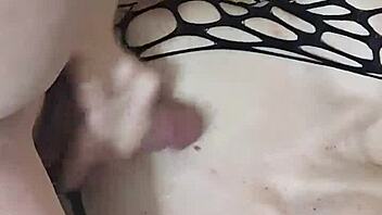 wife in fishnets and lingerie with husband