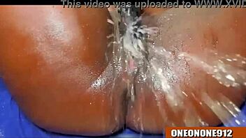 Ebony babe takes on huge cock with wild fingering and squirting action. She can’t hold back!