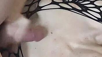 wife in fishnets and lingerie with husband