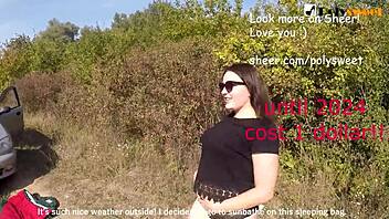 Teen brunette with glasses uses strapon outdoors