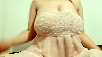 Hottie in chic dress teases with big breasts