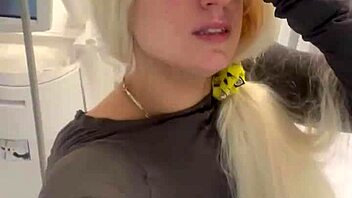 blonde teases by removing clothes then dressing again