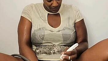 Ebony Babe Intensely Masturbates in Shower While Fully Clothed