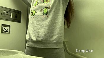 Risky airplane toilet masturbation without panties nearly gets caught