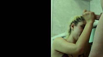 A Blonde Teen Gives A Blowjob In The Homemade Kitchen Setting