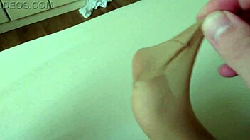 Having fun with my BBW slut's nylon feet on the bed