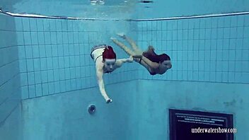 Close up of Katrin Privsem and Lucy Gurchenko’s wet and shiny skin in the pool