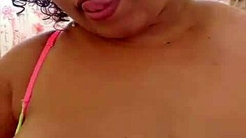 Big black beauty gets a chubby handjob and toys her pussy