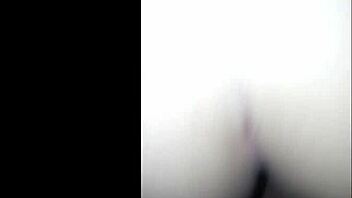 A hot and steamy scene with a Mexican beauty drenched in oil and wearing a tight cinturita
