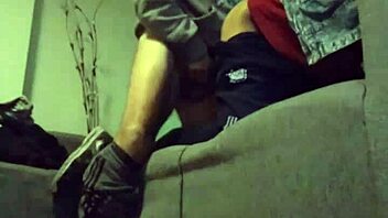 A gay couple enjoys intimate moments with blowjob and sex on the sofa.