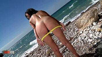 Hot brunette pornstar Mya Lorenn strips on the beach