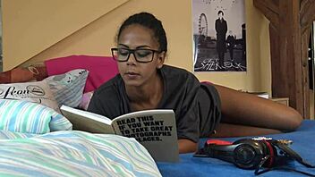 Beautiful brunette ignores you while reading naked