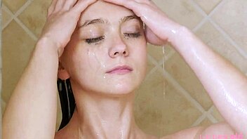 charming brunette model freshens up in shower