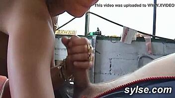 two french milfs flash and trio with a mechanic in a retro garage scene.