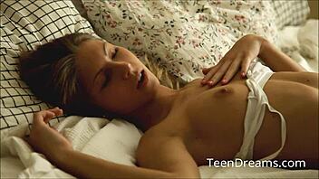 Anjelica is playing with her shaved pussy using a vibrator.