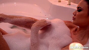 Jasmine Jae seducing in the bath, big tits on display! 😍