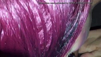 Tattoed goth chick sucks stranger's cock in video booth.