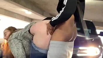 Redhead Mia Dior takes big black cock in public parking garage.