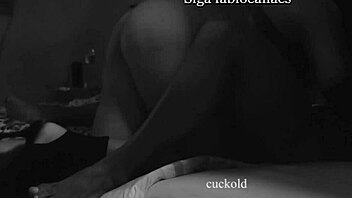 A hotwife gives a blowjob to a man with a big dick in front of her husband