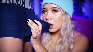 Blonde college coed teases boyfriend's cock over boxers.