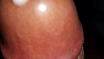 Watch a black cock cum from a homemade handjob.