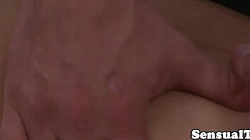 Asian ladyboy sucks hard cock during massage.