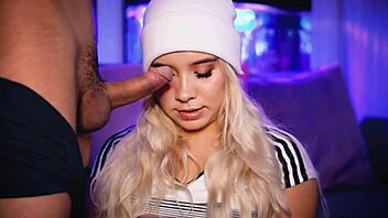 The cute blonde coed passionately deepthroats a big cock in college