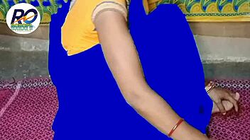 village girl lifts saree to show off while bent over at ranch.