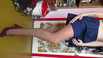 Custom video showing legs in skirt, stockings, and shoes.