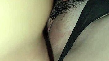 Young girl plays with pussy watching porn.