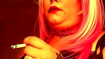 Chubby British domme Tina Nua smokes a Superking