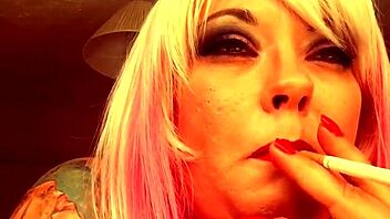 Chubby British domme Tina Nua smokes a Superking