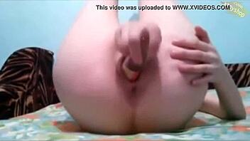 Amateur teen masturbates with a bottle of perfume