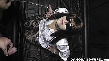 Wife endures extreme outdoor gangbang with plenty of men pissing on her.