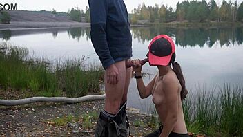 Brunette gives outdoor blowjob by the lake 😊