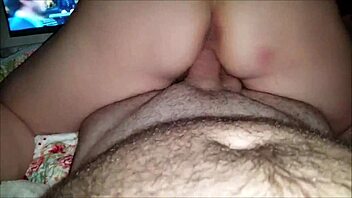 she rides his cock while watching the football game