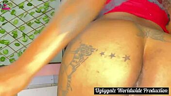 Watch this african lady in red masturbating with her tattooed black couple