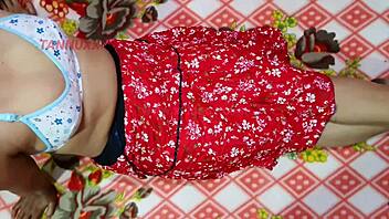 village girl in red dress with boyfriend outdoors