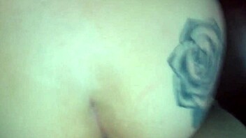 tattooed couple shares intimate moments