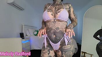 Petite tattooed bimbo tries on micro bikini for haul.