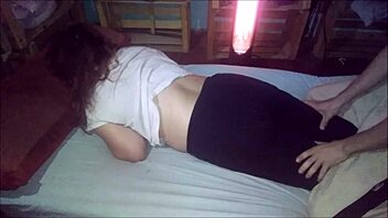 Latina milf gives rich massage to partner at night.