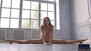 Tiny Russian teen Nimfa undresses in softcore video