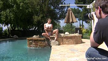 natasha nice enjoys a wet outdoor pool session.