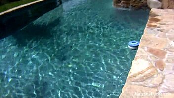 natasha nice enjoys a wet outdoor pool session.