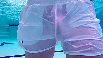 Pool boy Xnxxjohn shows off in see-through outfit. Underwater, his big cock is visible.