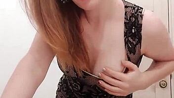 Big-boobed blonde masturbates with a dildo in the toilet