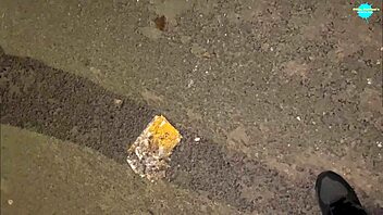 Street whore pushes items into her shaved pussy in public close-up