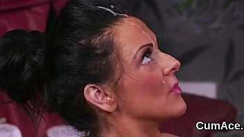 unusual model poses for a photoshoot. she gets facial makeup applied.