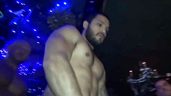 guys dance and bang in a wild night club orgy