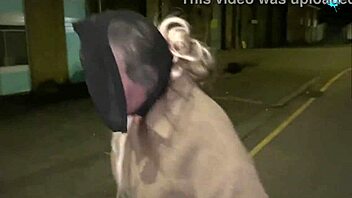 Street whore pushes items into her shaved pussy in public close-up